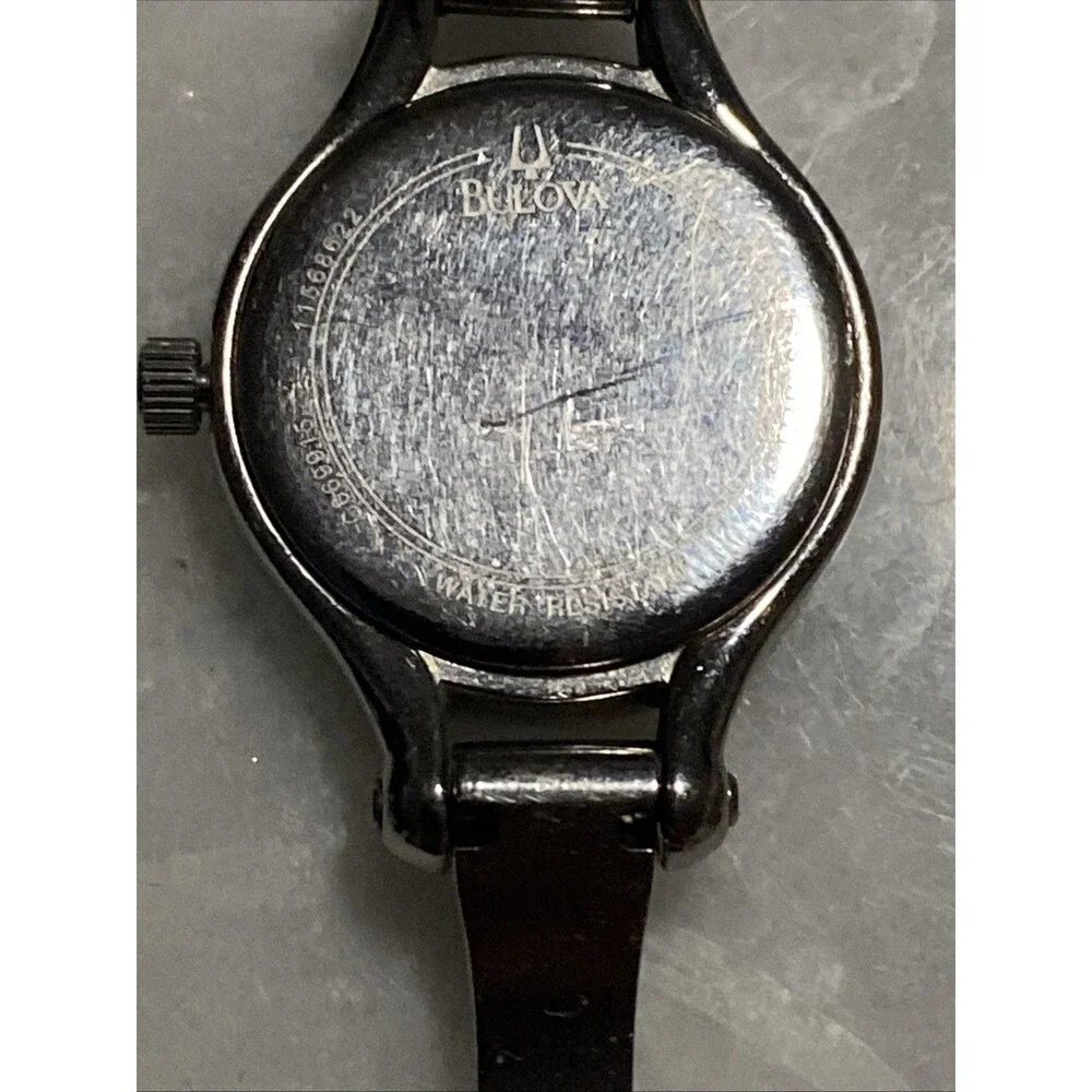 Bulova Women Silver Tone Crystal Bezel Mother Of Pearl Dial Bangle Watch C869915